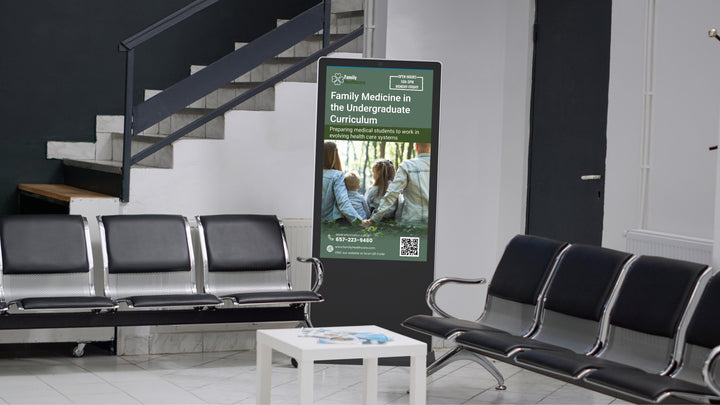 Indoor floor-standing kiosk in a clinic waiting room providing digital check-in and health information